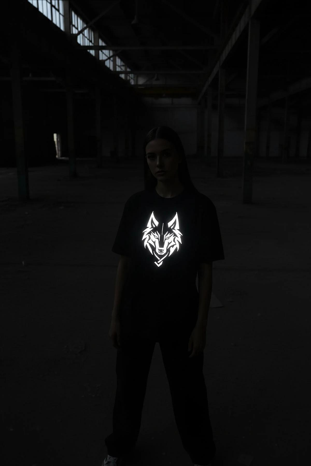 Black custom reflective graphic hoodie on a man, white brushed text "MERT 18"