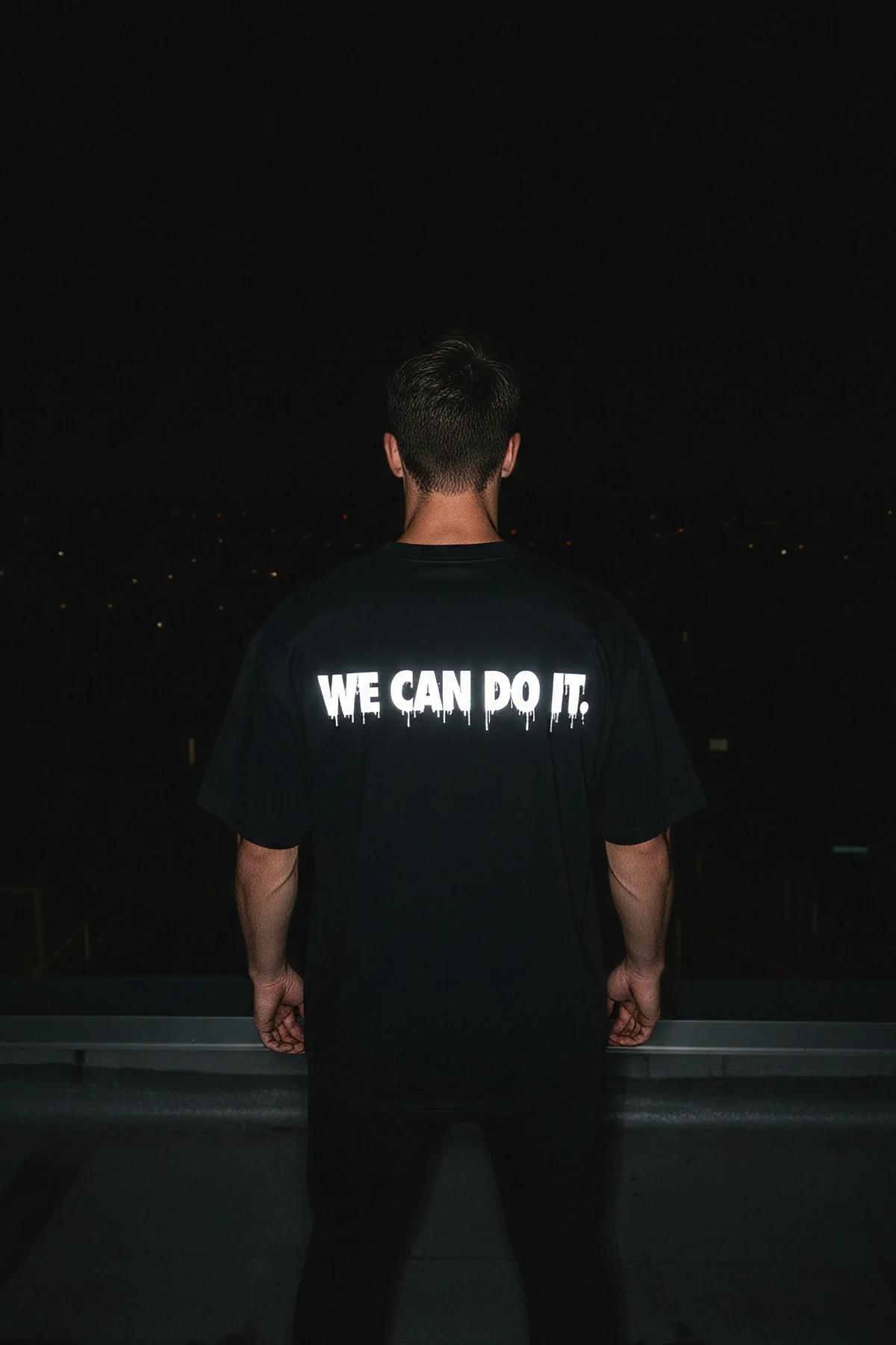 Black reflective graphic t-shirt with text on back