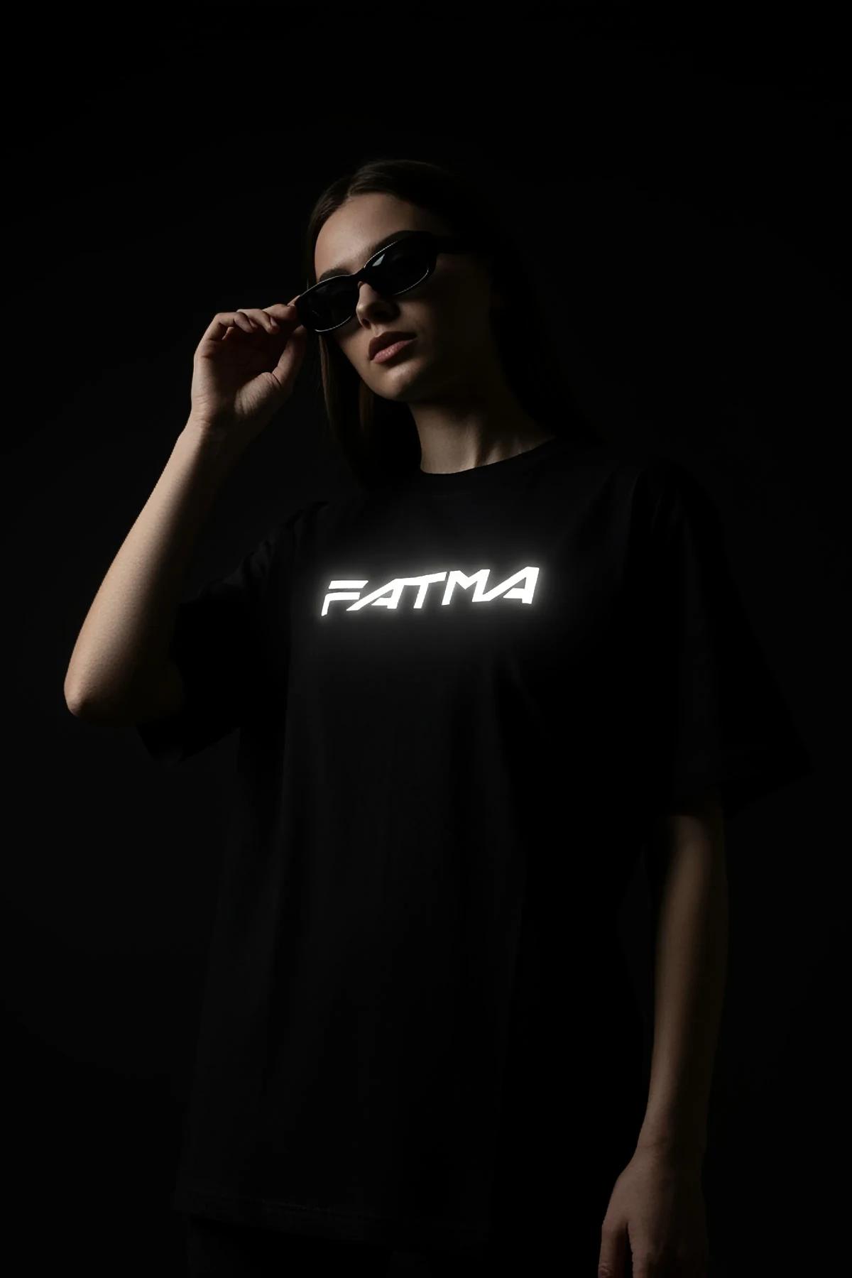Black Custom Reflective T-Shirt with 'FATMA' graphic for men, model wearing dark sunglasses