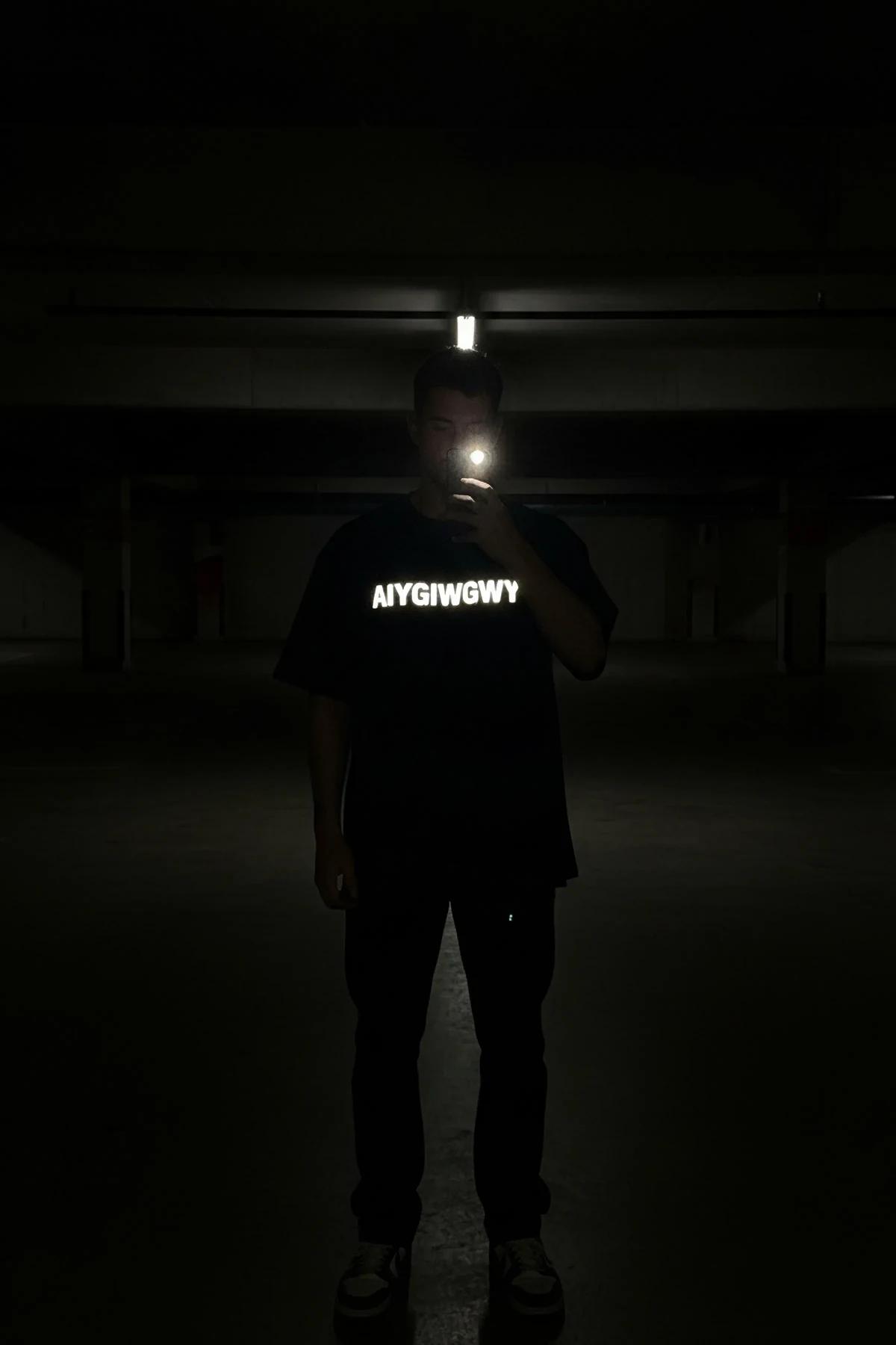 Oversized Reflective Graphic T-Shirt Black with White Text Streetwear Style