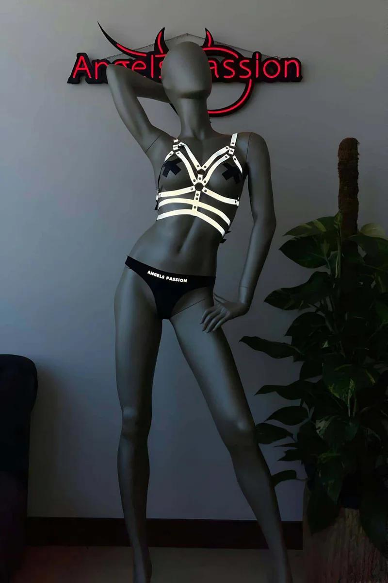 Festival Reflective Harness Set Flat Lay with Blacklight Effect in Silver and Black, featuring chest harness and matching