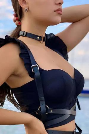Black faux leather chest harness with O-ring choker detail