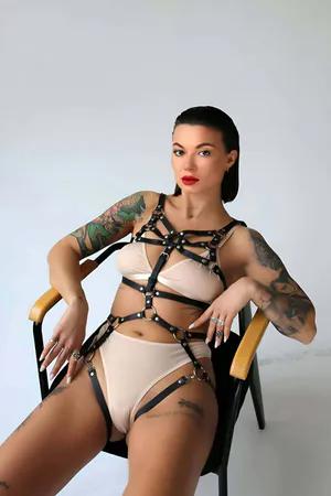 Black faux leather strappy full body harness with O-ring accents