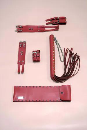 Red Faux Leather Restraint Set with Two Cuffs, Body Straps, and a Studded Whip