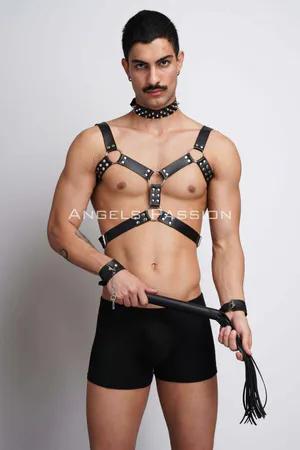 Black faux leather chest harness with studded details, spiked choker, and cuffs, worn by a male model.