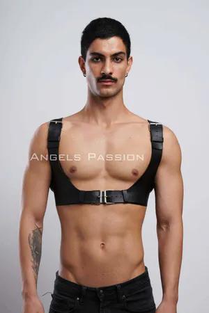 Black faux leather chest harness with silver buckle and adjustable straps on male model