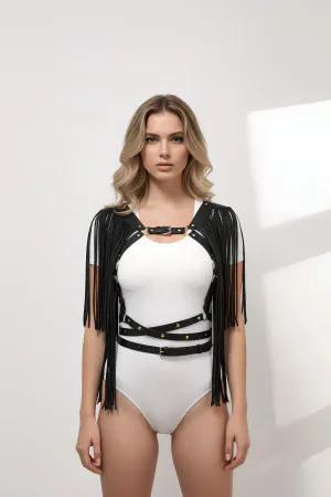 Black faux leather body harness with adjustable straps and dramatic swinging fringe.