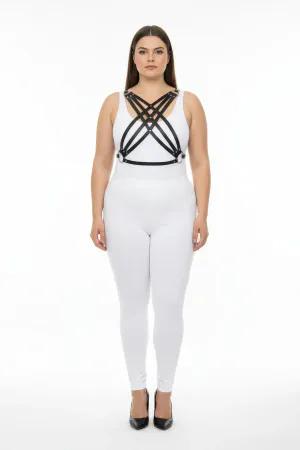 Black faux leather strappy chest harness worn by a plus-size model