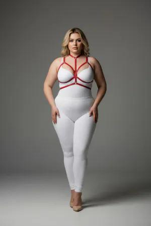 Red vegan leather body harness with adjustable straps and a central O-ring worn by a plus-size model