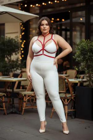Red vegan leather body harness with adjustable straps and a central O-ring worn by a plus-size model