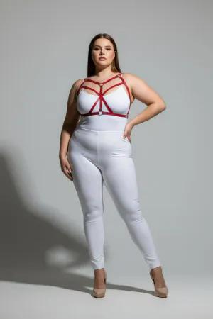 Red faux leather strappy body harness on a plus-size model
