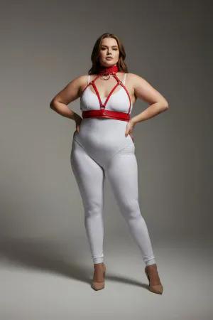 Red faux leather strappy body harness with matching choker and O-ring, worn by a plus-size model.