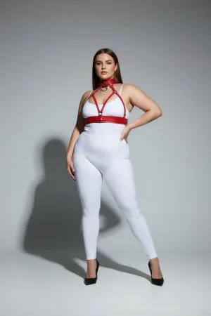 Red faux leather strappy body harness with matching choker and O-ring, worn by a plus-size model.