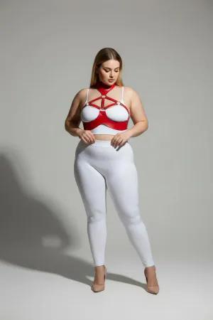 Red faux leather collar and chest harness set worn by a plus-size model.