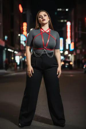 Red Faux Leather Star Chest Harness with Draping Chains Worn Over Black Dress