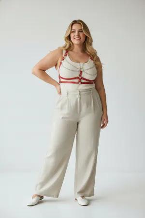 Red Faux Leather Chest Harness with Draped Chains Over White Tank Top