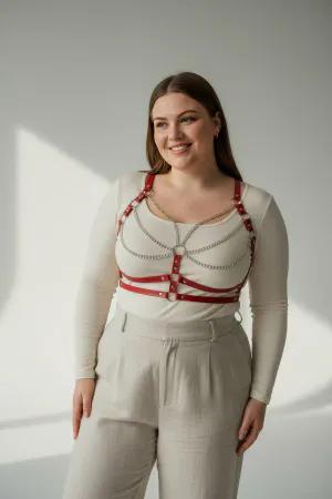 Red Faux Leather Chest Harness with Draped Chains Over White Tank Top