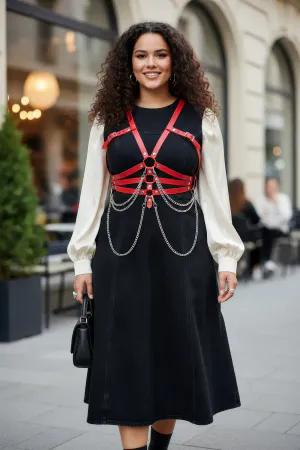 Red Faux Leather Chest Harness with Draping Chains Worn Over Dress