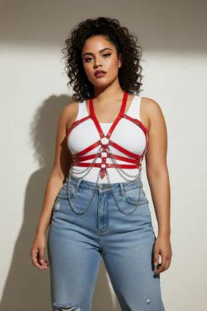 Red Faux Leather Chest Harness with Draping Chains Worn Over Dress