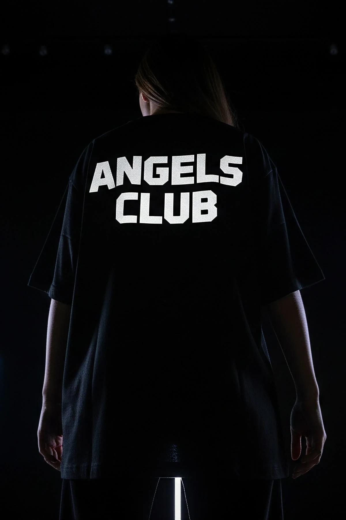 black oversized boxy t-shirt dropped shoulder crew neck mid-thigh length streetwear styling