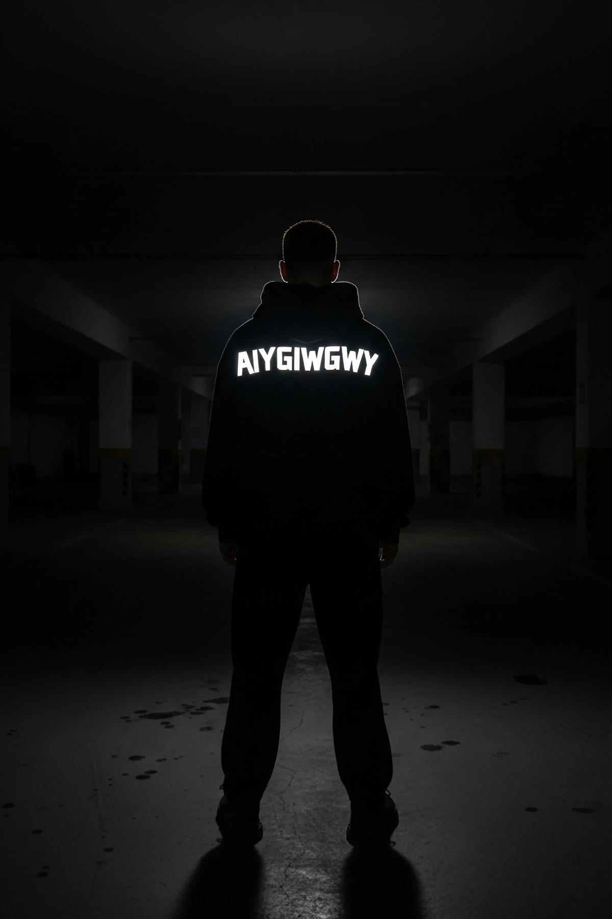 Black heavyweight cotton hoodie with personalized reflective block-text graphic, side angle