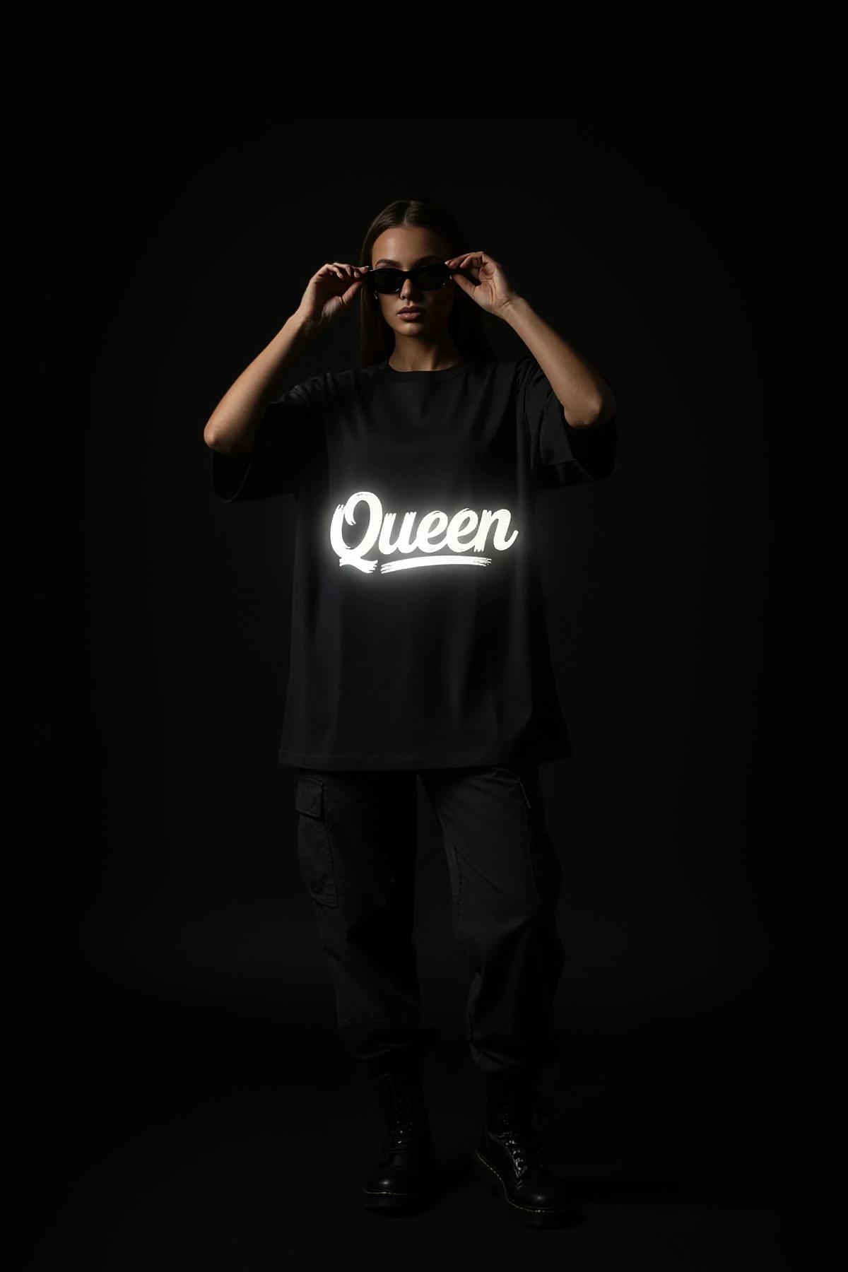 oversized black custom text tee flat lay showing 200 gsm cotton-jersey fabric texture and matte finish