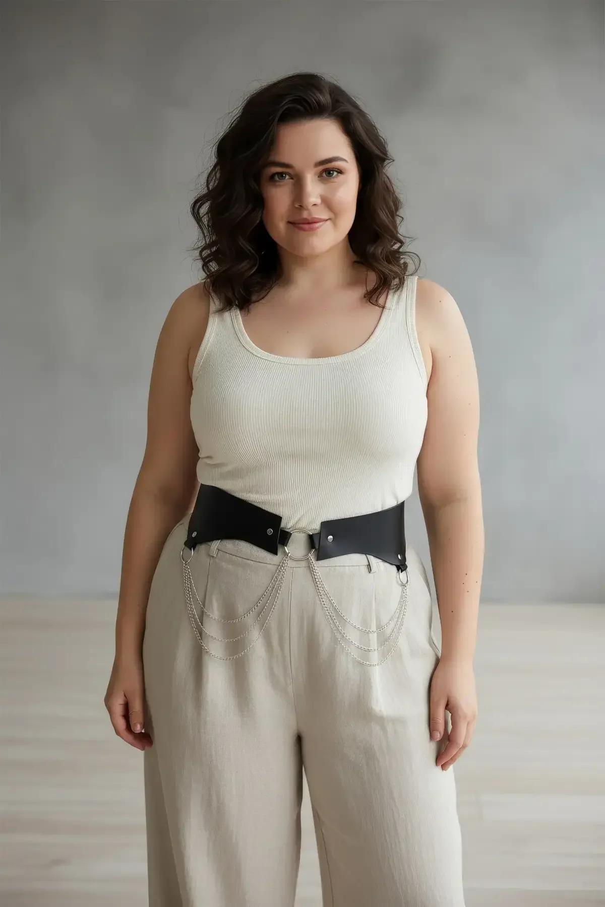side view of cascading silver hip chains on black waist harness belt