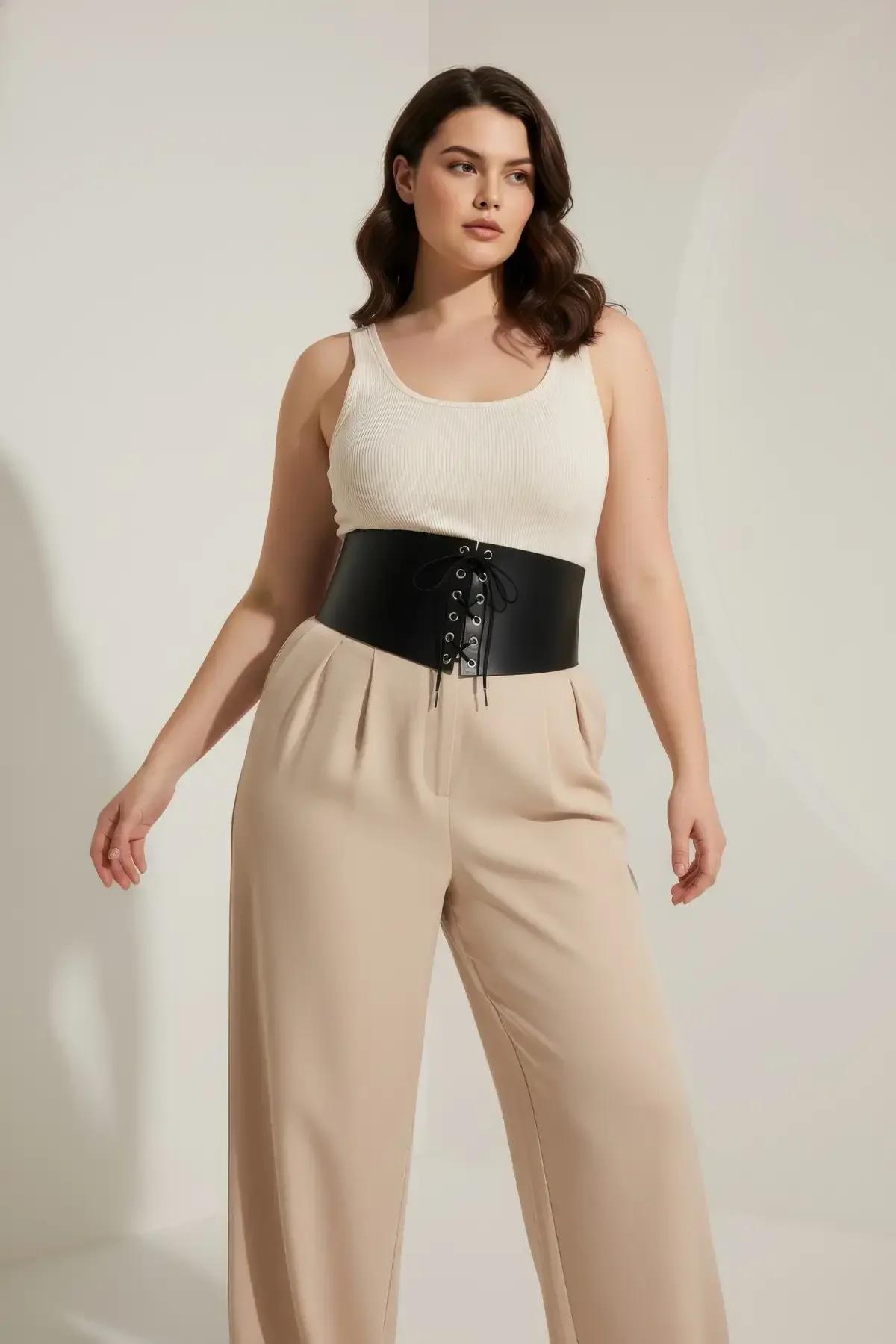 close-up of black faux leather cincher lace-up front panel with silver metal eyelets detail