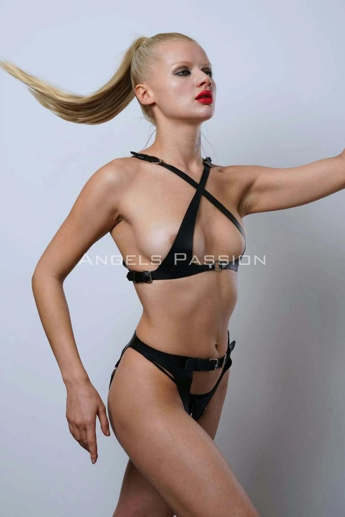 Close-up of silver-tone pin-buckle hardware on black faux leather high waist harness briefs