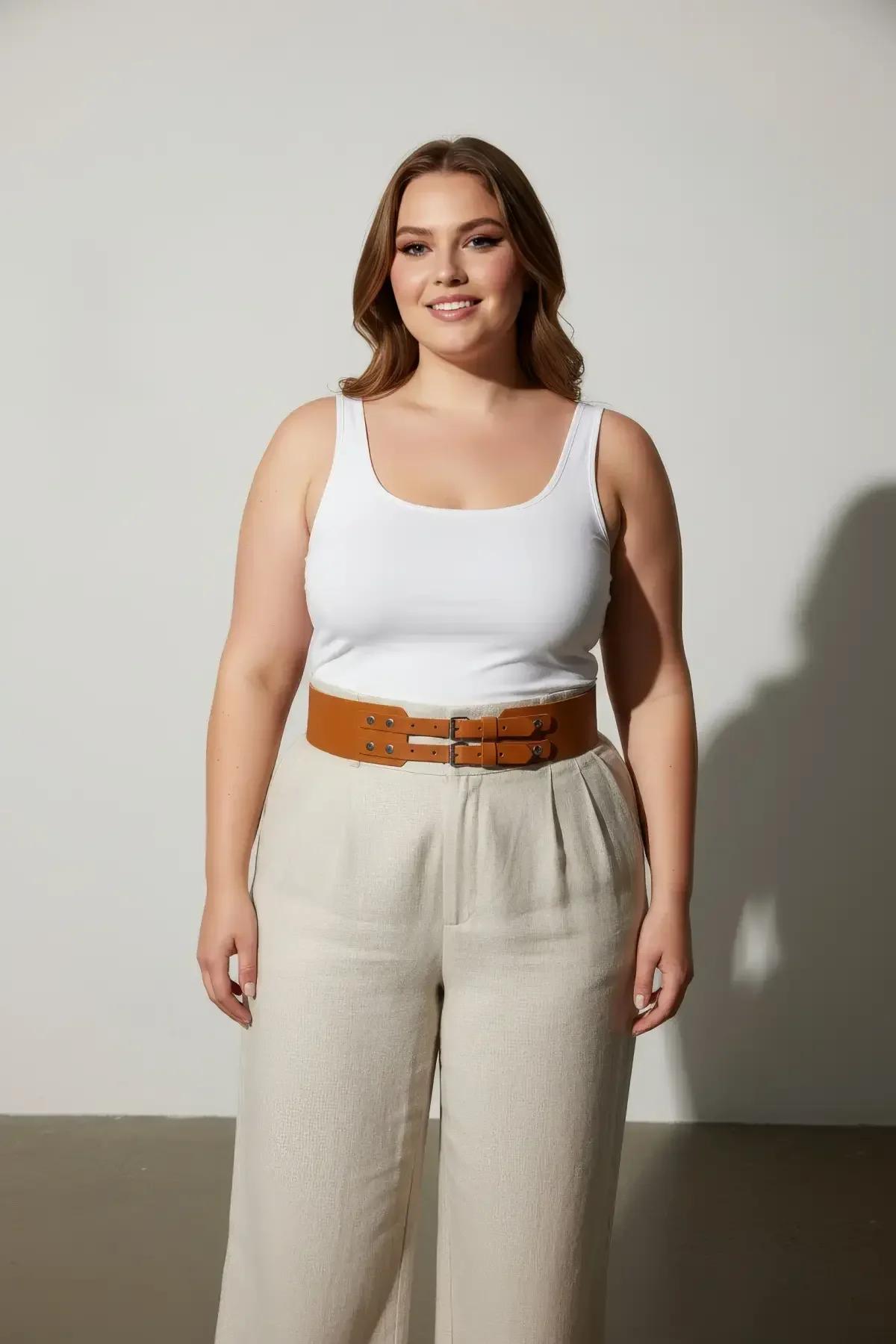 tan vegan leather corset belt laid flat showing parallel straps and brushed silver buckles
