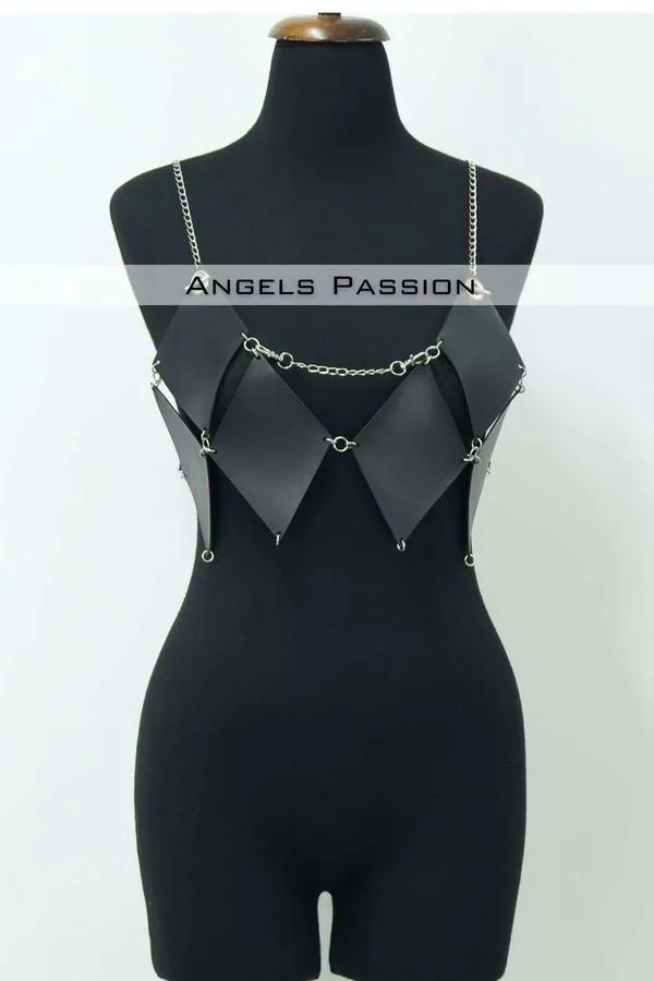 Black faux leather diamond panel body harness top with silver chain straps and O-ring connectors on mannequin