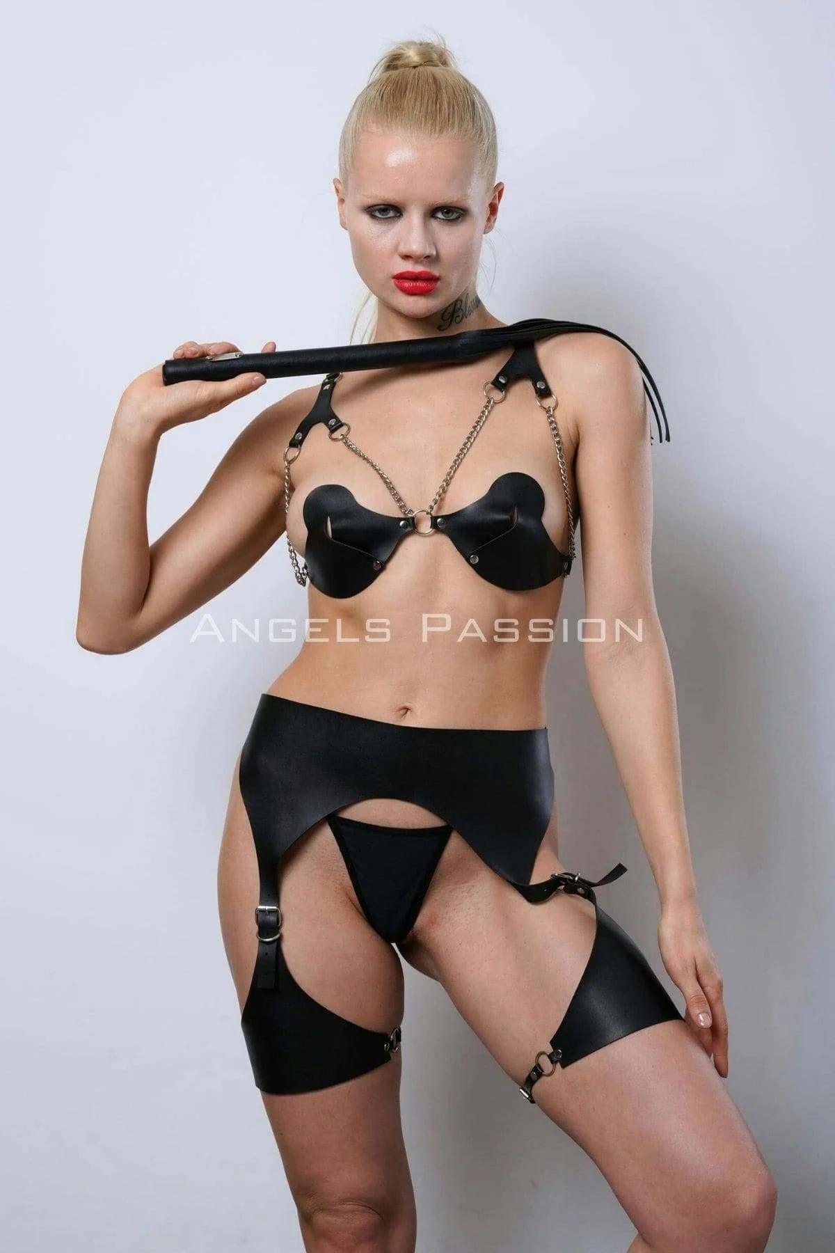 Full three-piece black faux leather harness set: bra, garter belt, and upper thigh bands flat lay