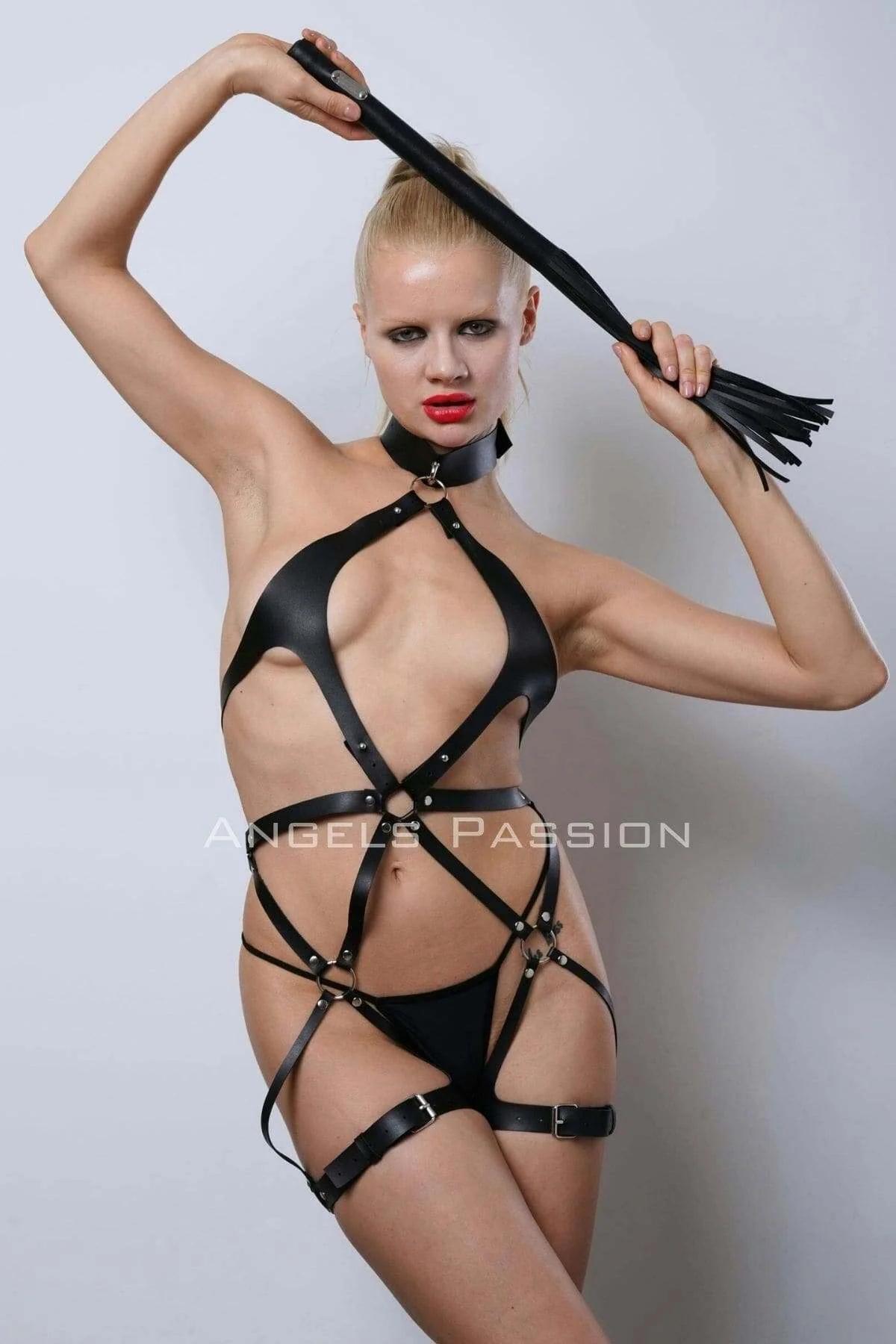 Close-up of black faux leather choker collar with silver front O-ring on full body harness