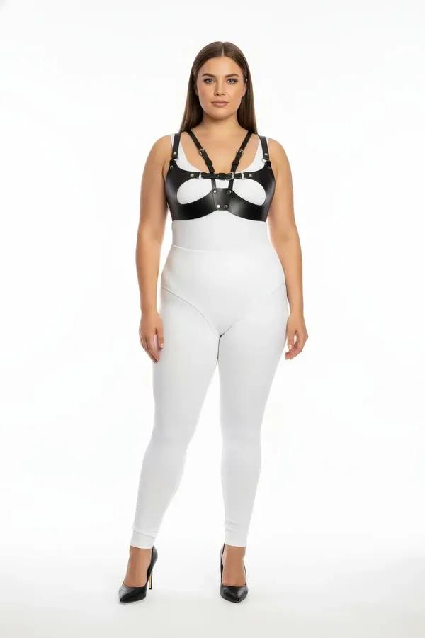 black faux leather harness bra with silver O-ring buckle and oval cut-out chest panel on plus-size model