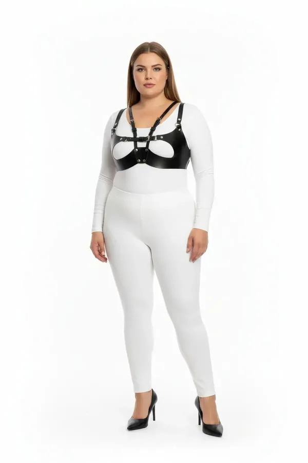 black faux leather harness bra with silver O-ring buckle and oval cut-out chest panel on plus-size model