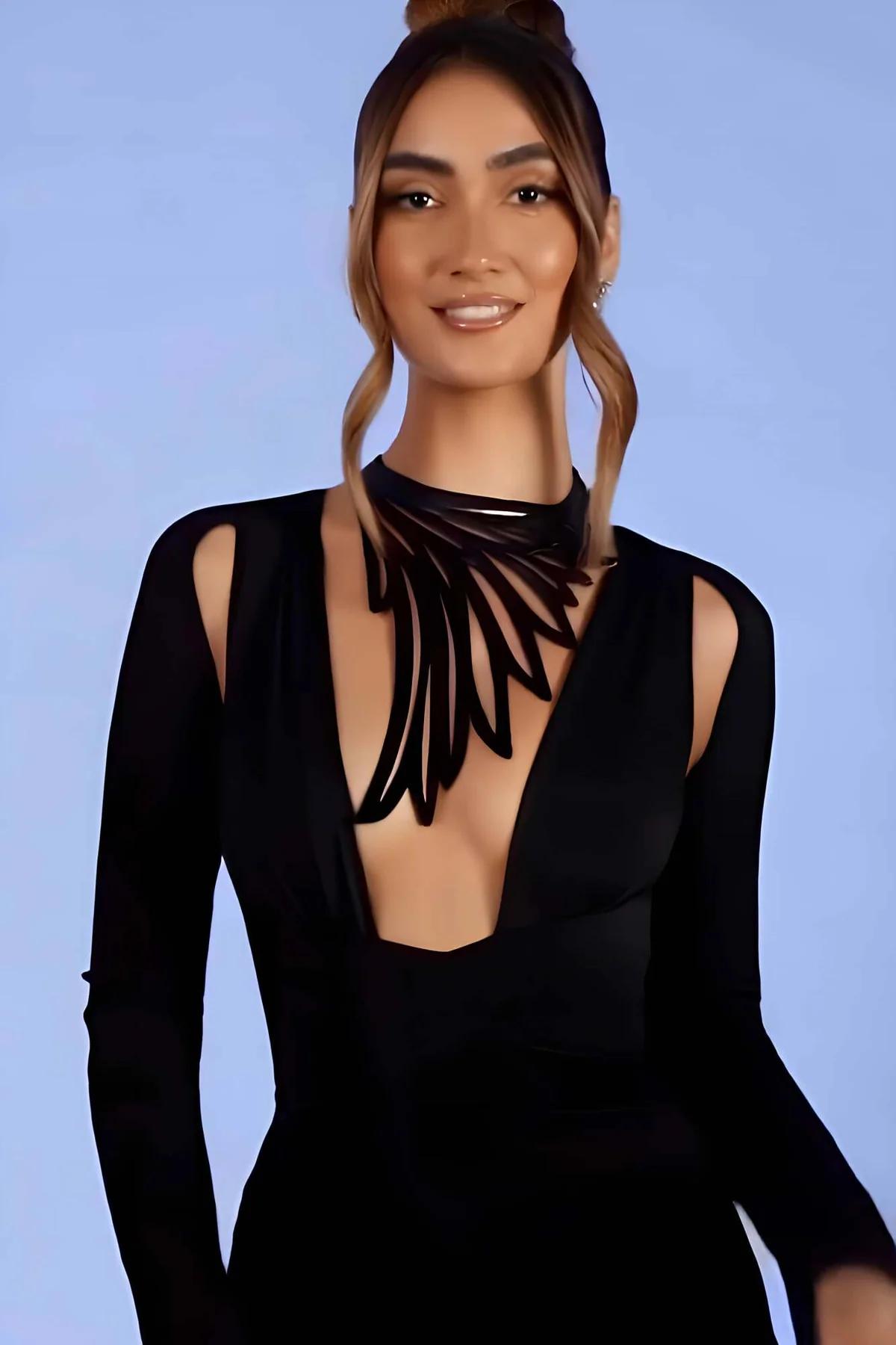 back view of black faux leather wing choker showing adjustable clasp closure at neckline