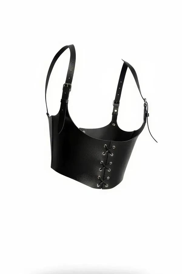 Black faux leather corset harness with silver eyelet lace-up front panel and adjustable shoulder buckle straps
