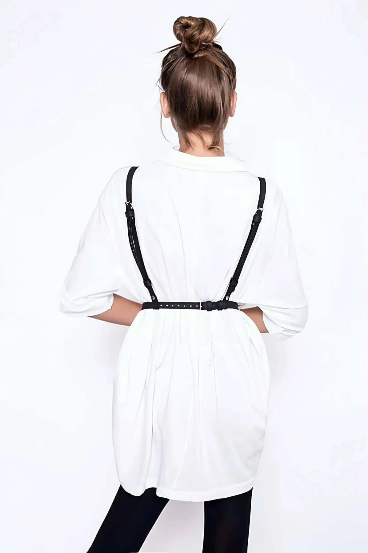 Adjustable black PU leather chest harness front view showing silver dome studs and O-ring detail