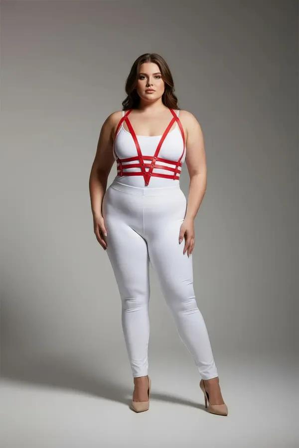 red faux leather strappy body harness with four horizontal chest bands and silver hardware worn by plus-size model