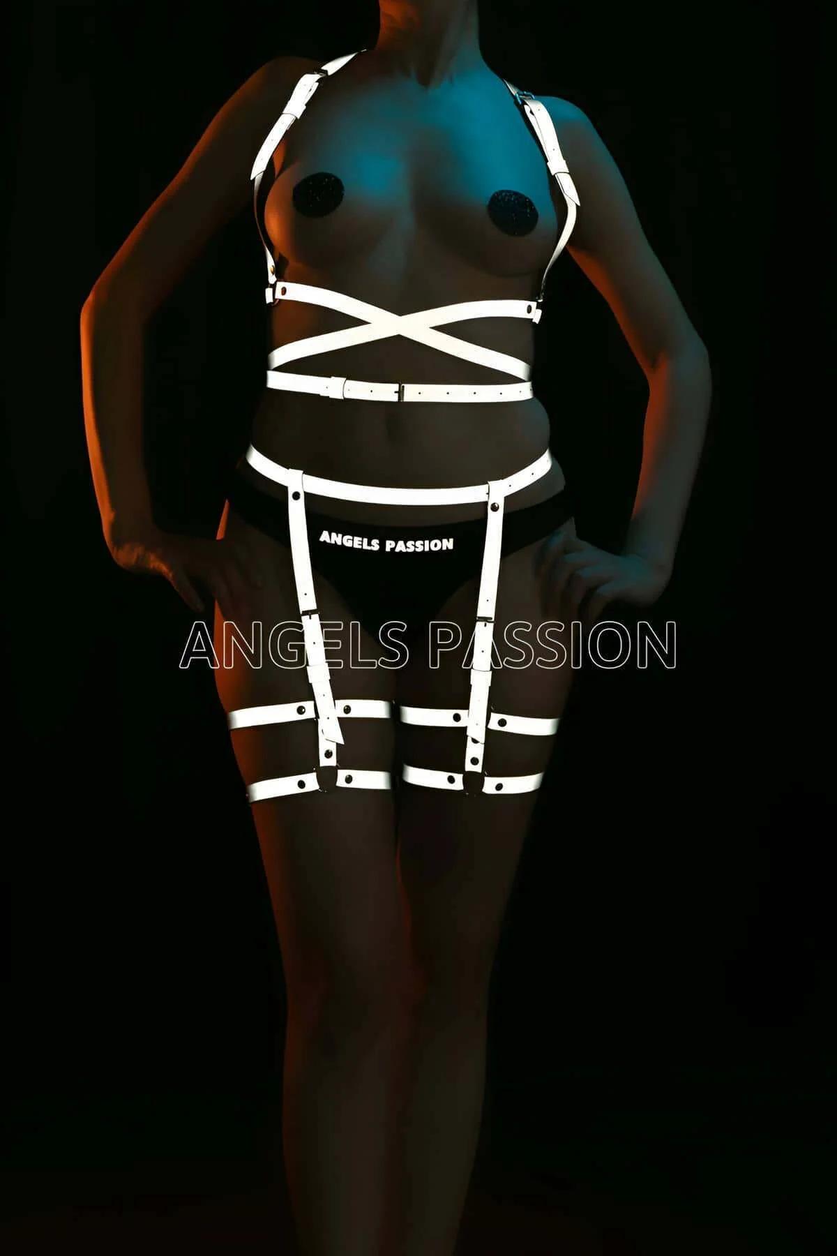 Reflective waist cage harness showing adjustable slider buckles and crossed front panel detail