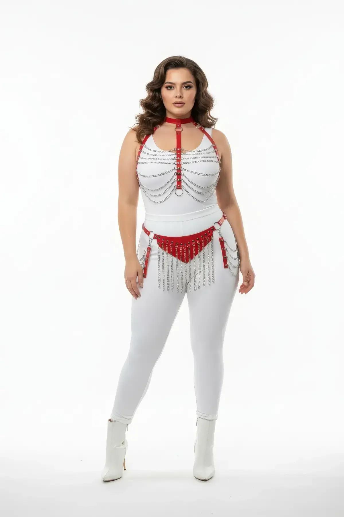 Red faux leather harness set with silver chain drape on chest and studded waist belt with long chain fringe, modeled on plus-
