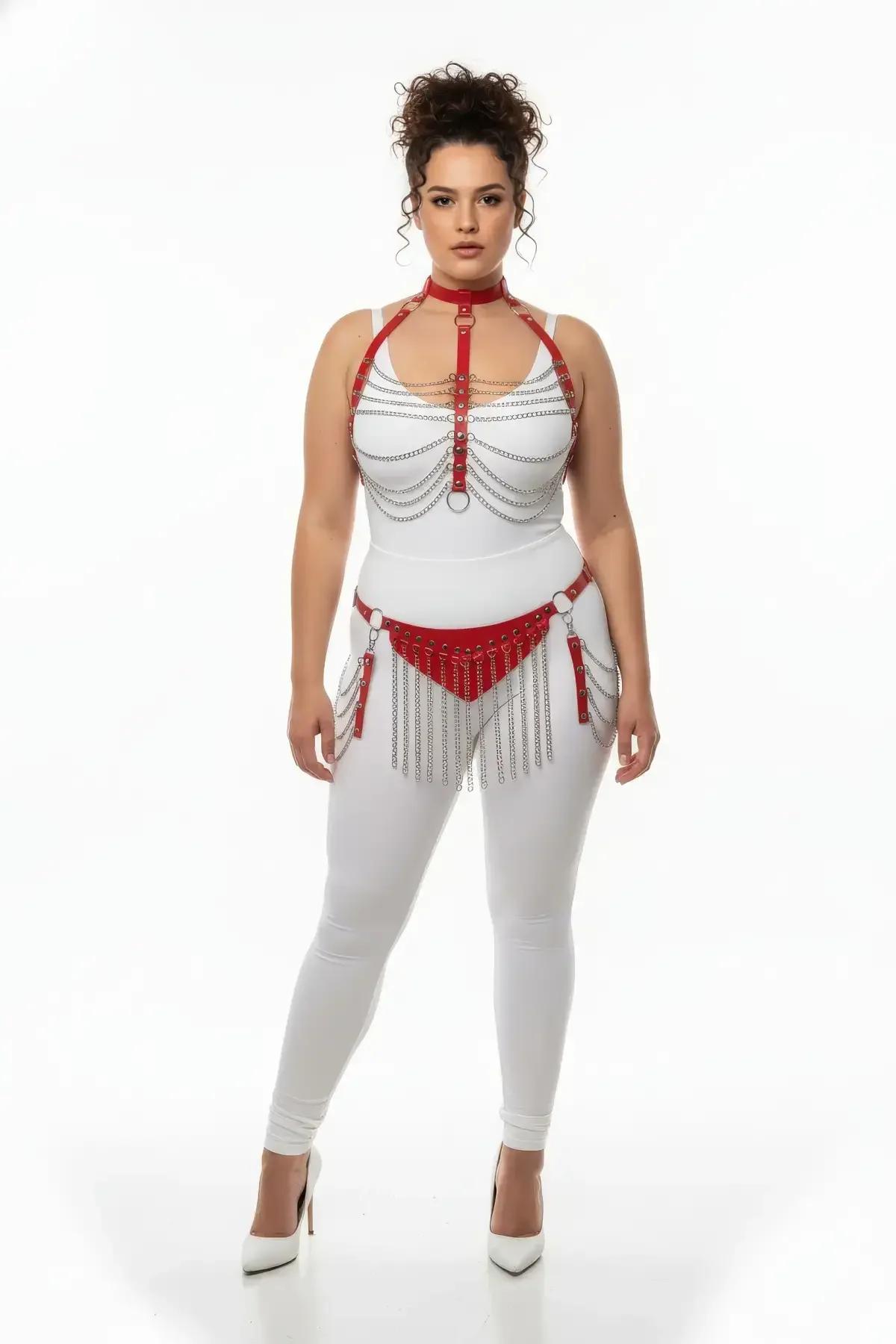 Close-up of red faux leather chest harness with five draped silver chains and central O-ring detail