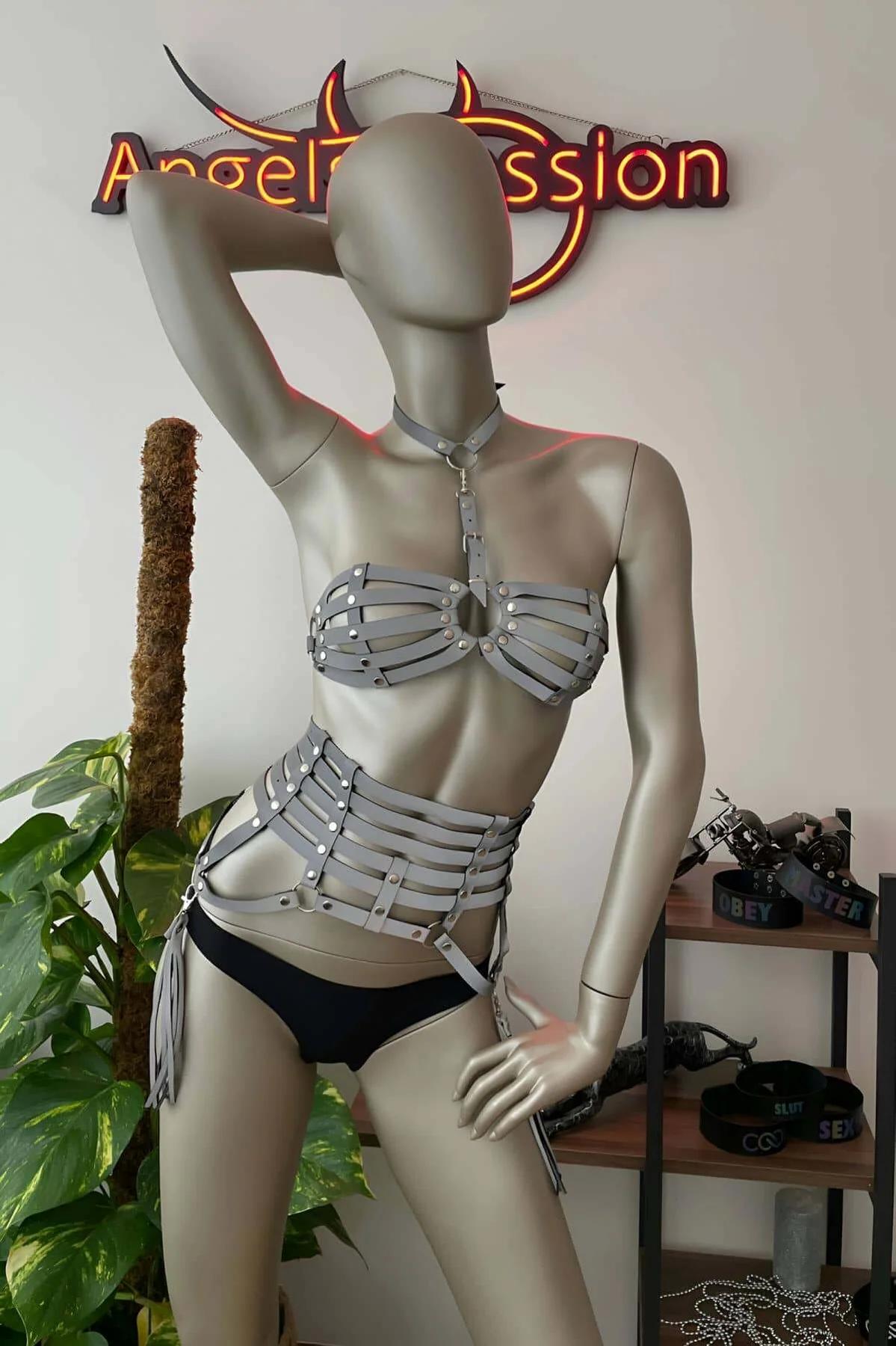 Fringe leg straps hanging from white reflective harness waist belt, approximately 20 cm length