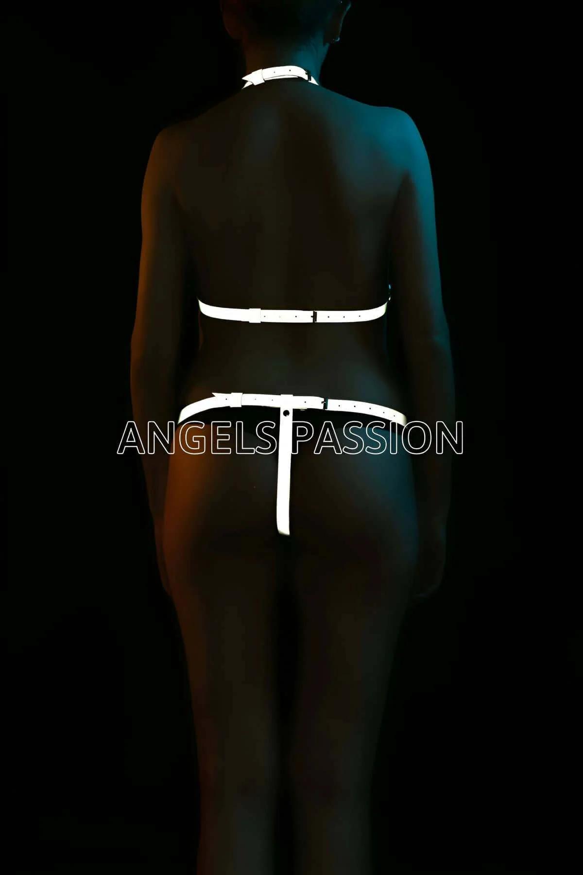White reflective harness set full body view showing bra and briefs geometric strap silhouette under direct light