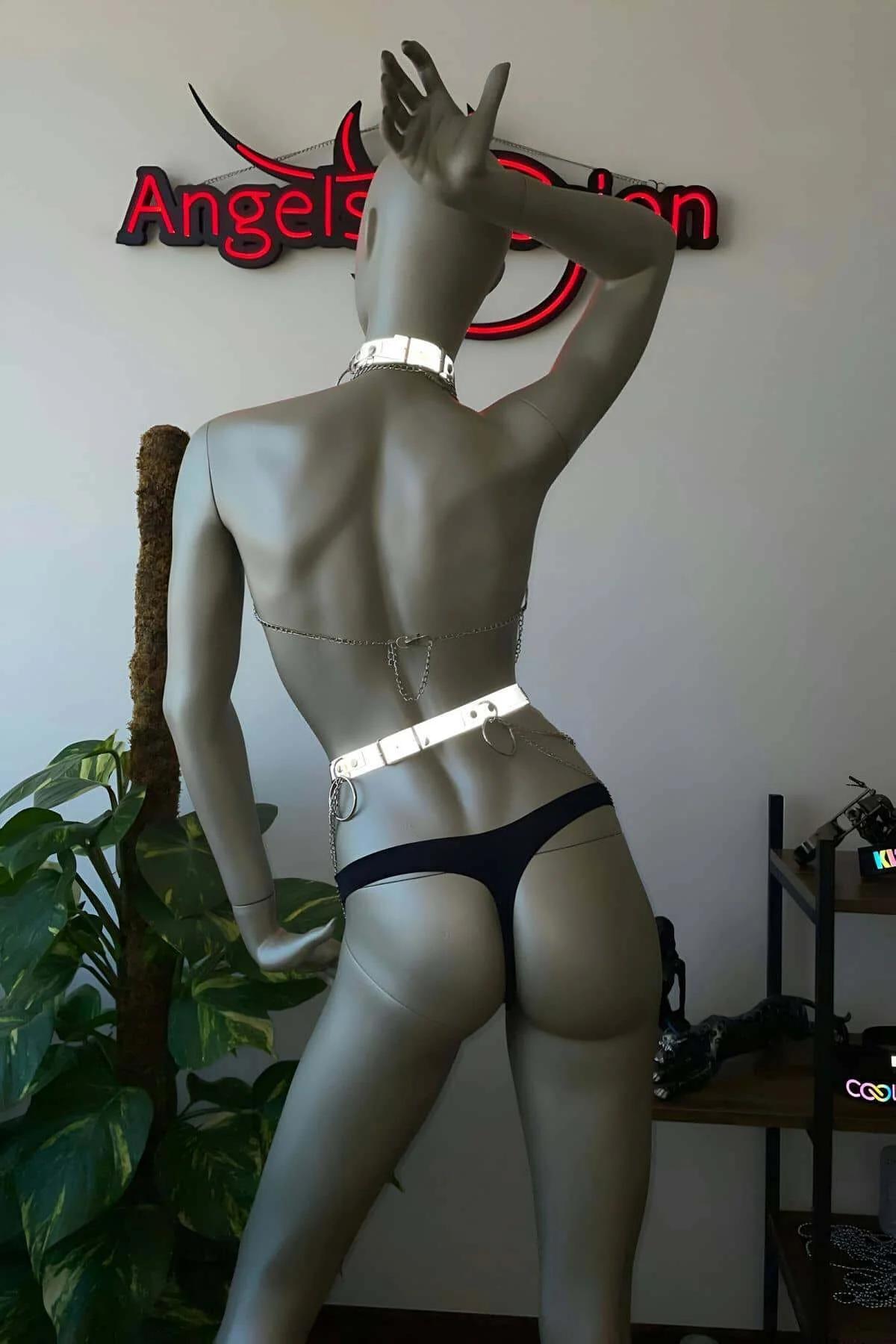 Full-body side view of white reflective harness set showing chain drape and fit on mannequin