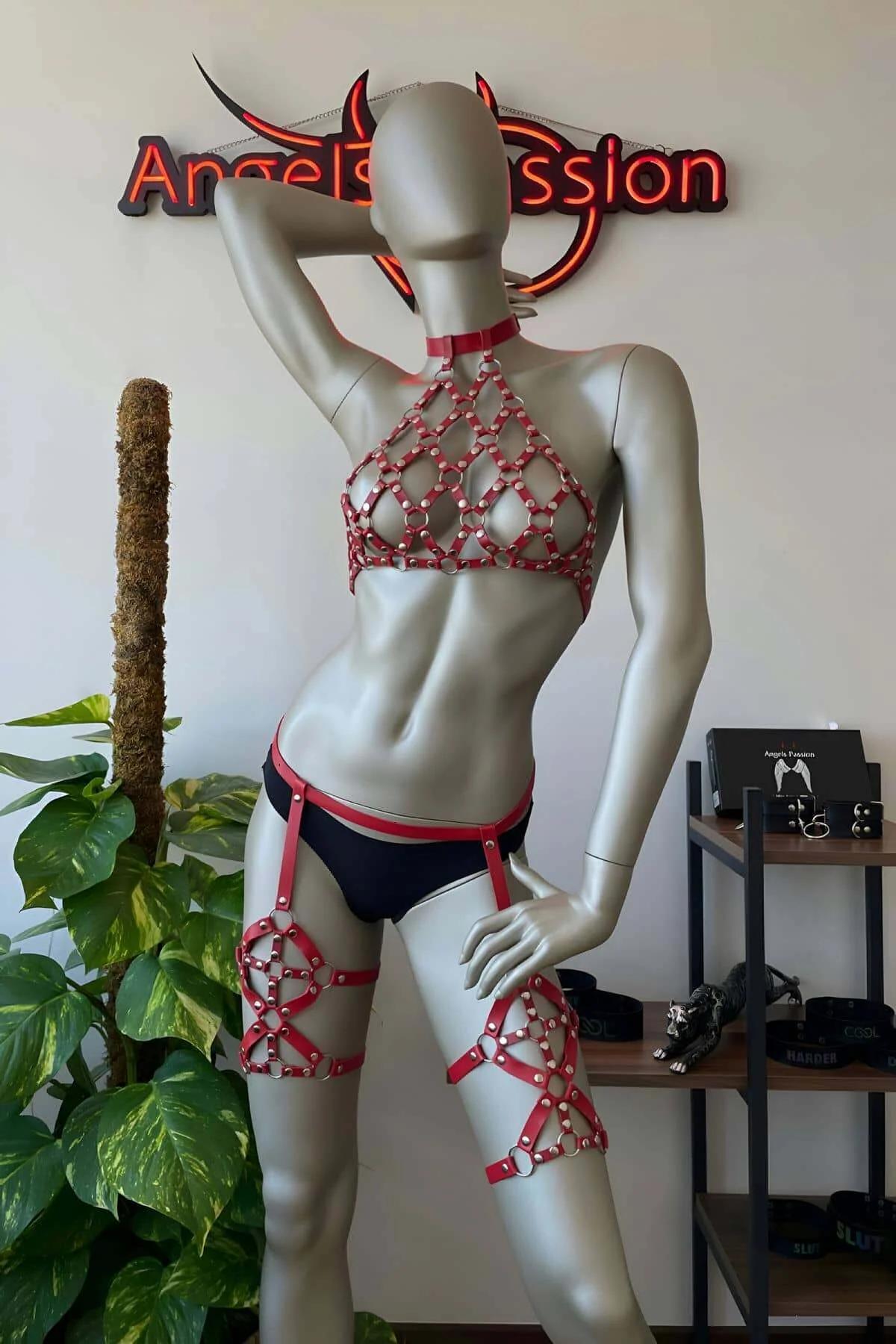 rear view of red faux leather body harness showing adjustable slide buckles and strap configuration