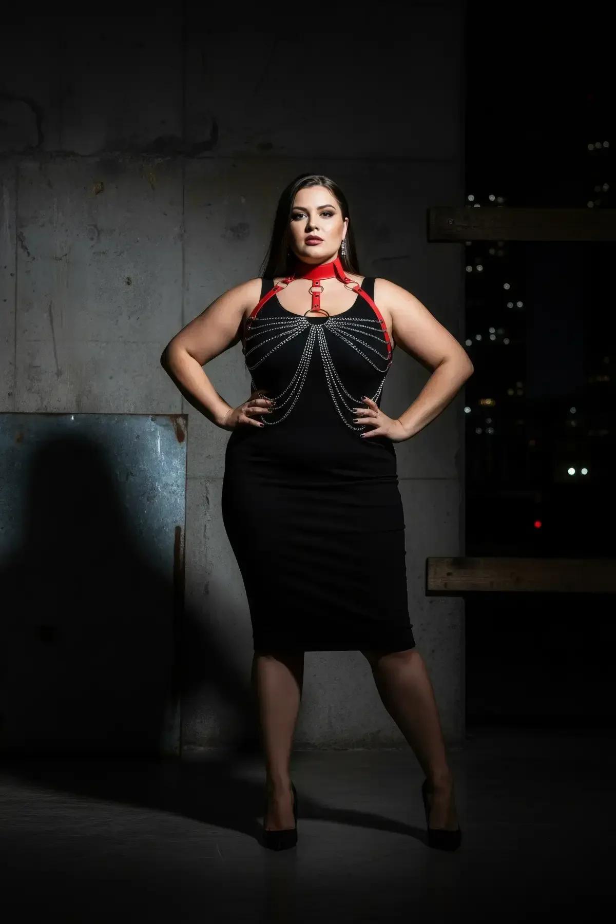 Back view of red faux leather harness showing metal buckle choker closure