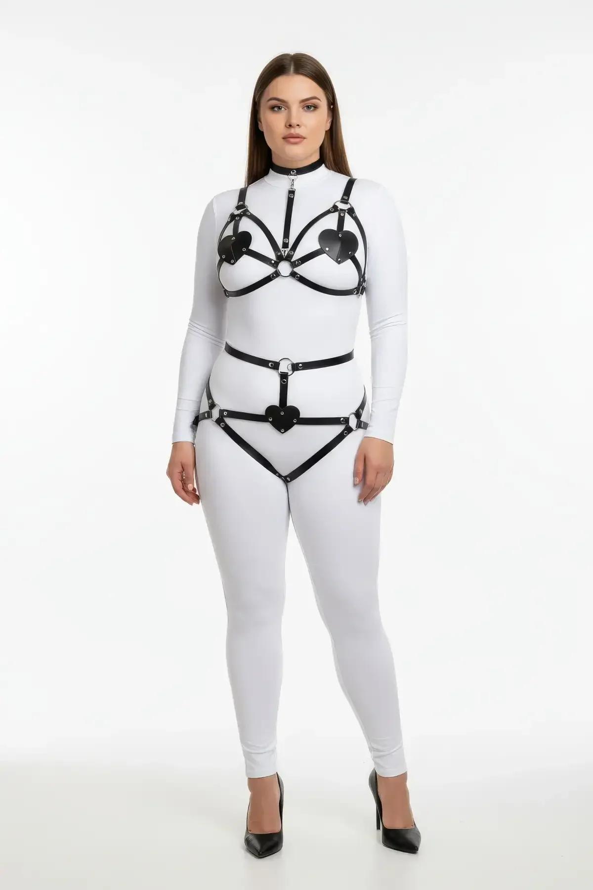 close-up of black faux leather heart cut-out bust panels with silver O-ring hardware on chest harness
