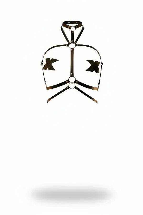 black faux leather strappy harness with X-bust crossings and three silver O-rings on white background