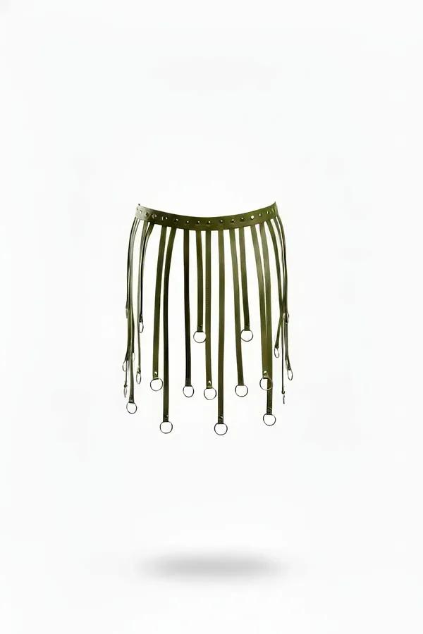 Olive green faux leather harness skirt overlay with 14 staggered straps ending in silver O-rings, riveted waistband, white ba